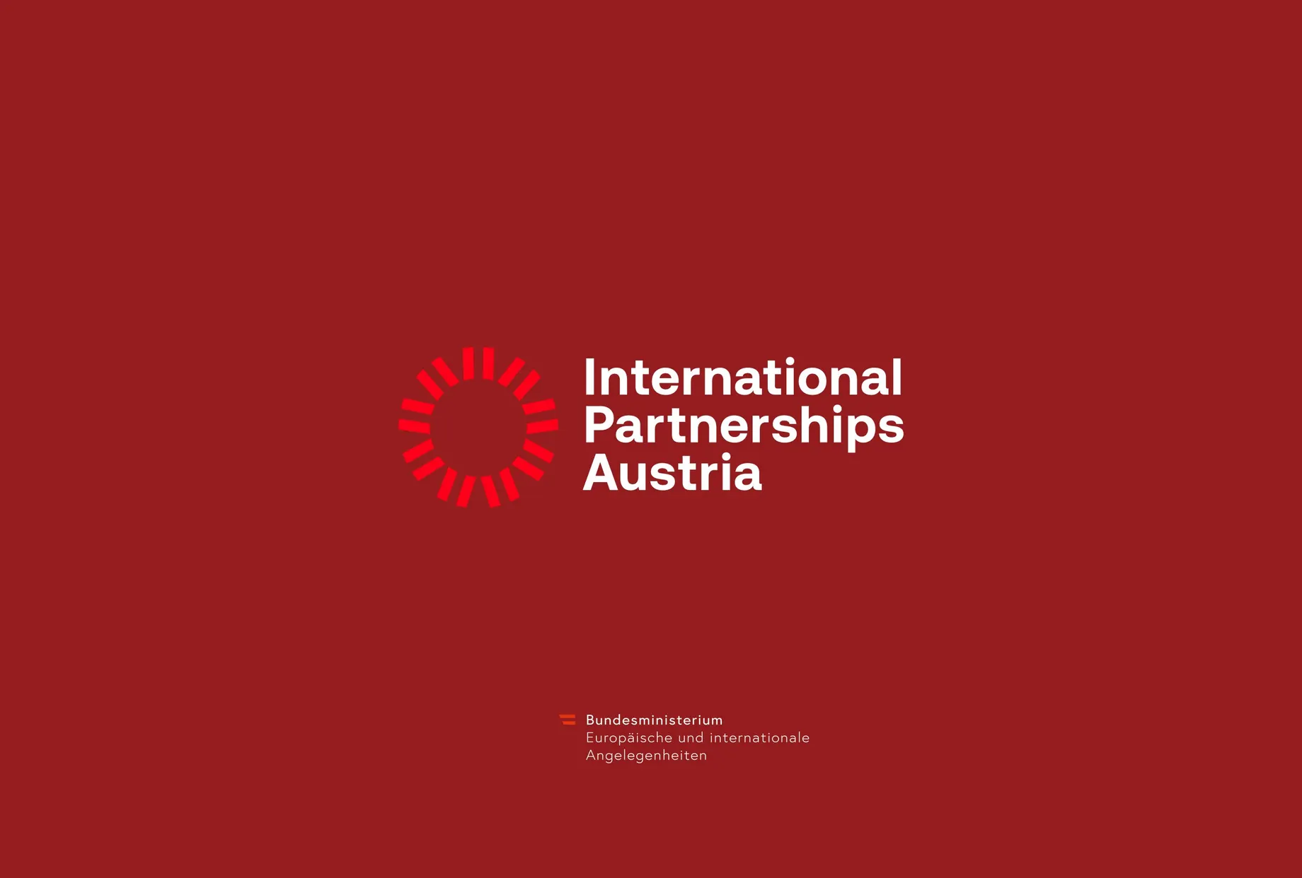 International Partnerships Austria logo on a red background